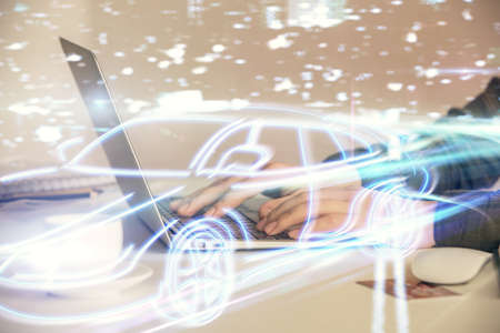 Double exposure of woman hands typing on computer and automobile theme drawing. High Tech concept.の写真素材
