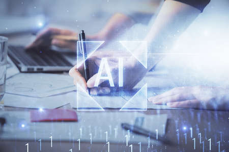 Double exposure of woman hands working on computer and data theme hologram drawing. Tech concept.の写真素材