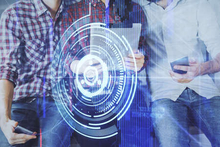 Double exposure of data theme hologram drawing and man and woman working together holding and using a mobile device.の写真素材
