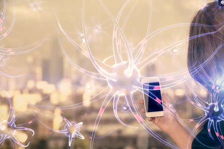 Double exposure of neuron sketch hologram and woman holding and using a mobile device. Education concept.の写真素材