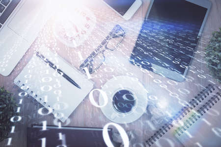 Double exposure of technology theme drawing over work table desktop. Top view. Global data analysis...