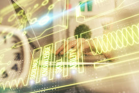 Double exposure of woman hands typing on computer and general theme hologram drawing. Education...