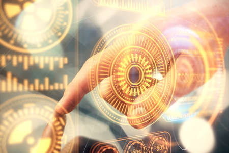 Double exposure of man's hands holding and using a digital device and tech theme hologram drawing....