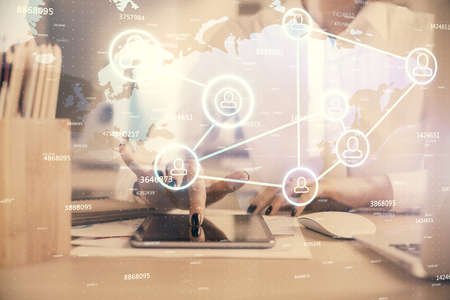 Double exposure of social network sketch hologram and woman holding and using a mobile device.