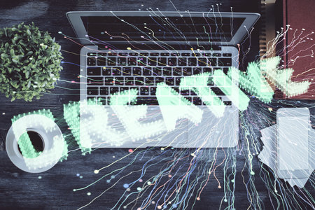 Start up theme drawing over computer on the desktop background. Top view. Double exposure. Brainstorm concept.の写真素材