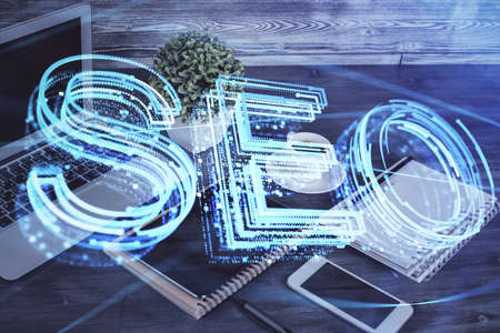 Double exposure of SEO drawing and cell phone background. Concept of data search optimizationの写真素材