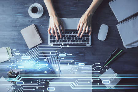 Double exposure of woman hands working on computer and data theme hologram drawing. Top View....