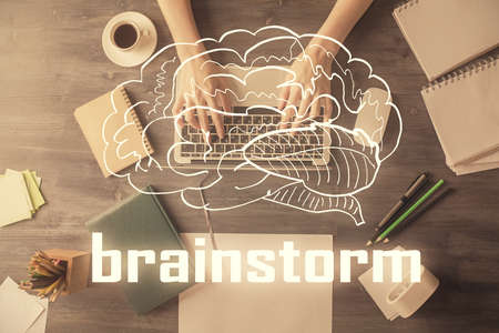 Double exposure of woman hands working on computer and creative hologram drawing. Top View. Start up concept.の写真素材