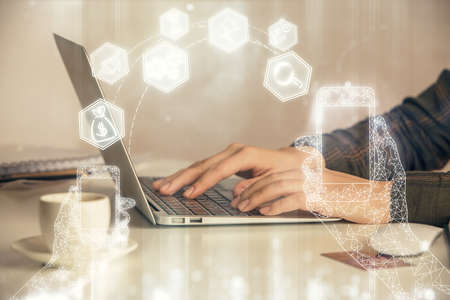 Double exposure of woman hands typing on computer and technology theme drawing. High Tech concept.
