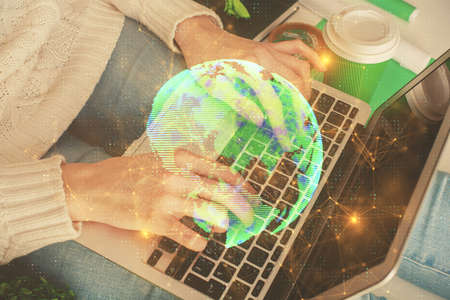 Double exposure of woman hands typing on computer and social network theme hologram drawing. People media concept.の写真素材