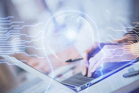Double exposure of woman hands working on computer and brain hologram drawing. Ai concept.