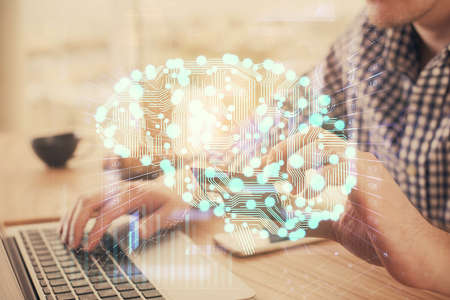 Double exposure of man hands typing on computer with credit card and brain theme drawing. E-commerce and AI concept.の写真素材