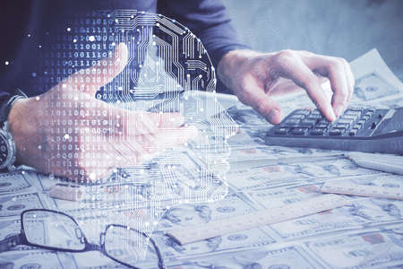 Double exposure of man's hand holding and using a digital device and brain hologram drawing. Data concept.の写真素材