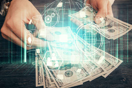 Multi exposure of social network theme drawing hologram and USA dollars bills and man hands.の写真素材