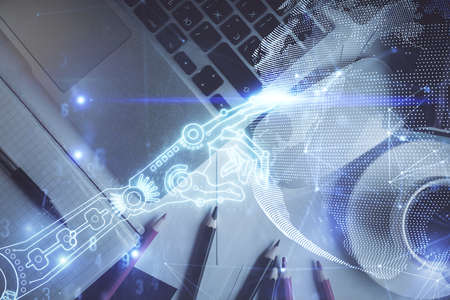 Technology hologram drawing over computer on the desktop background. Top view. Double exposure. Tech...