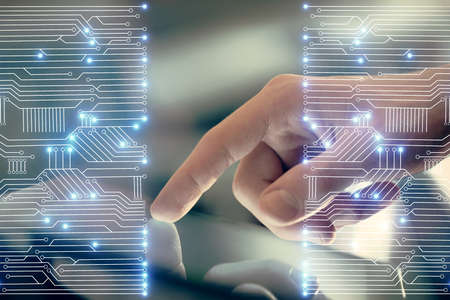 Double exposure of man's hands holding and using a digital device and tech theme hologram drawing....