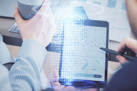 Multi exposure of man's hands holding and using a digital device and data theme drawing. Innovation...