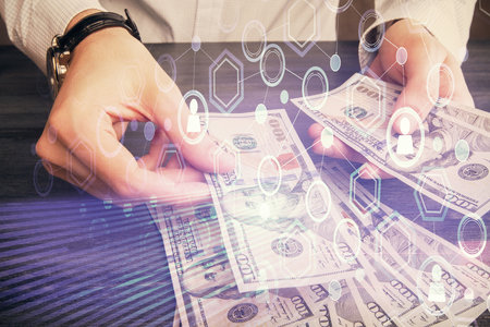 Multi exposure of social network theme drawing hologram and USA dollars bills and man hands.