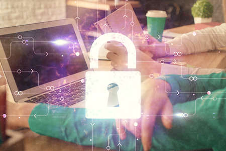 Double exposure of man and woman working together and technology theme lock drawing hologram....