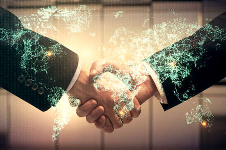 Double exposure of social network theme hologram and handshake of two men.の写真素材