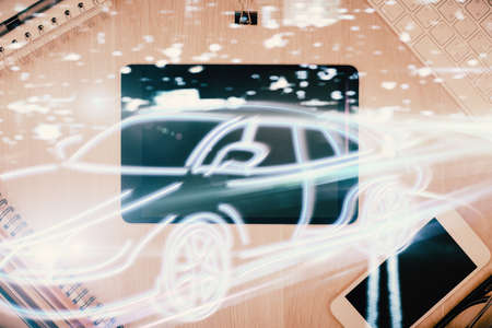 Multi exposure of auto technology theme drawing over table with phone. Top view. Concept of automatic pilot.の写真素材