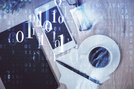 Double exposure of technology theme drawing over work table desktop. Top view. Global data analysis...