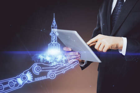 Double exposure of man's hands holding and using a mobile device and creative hologram drawing.の写真素材