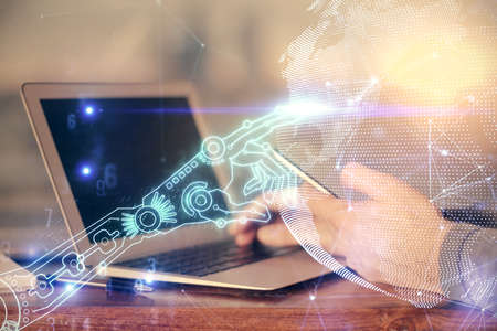 Double exposure of man's hands holding and using a digital device and tech theme hologram drawing....