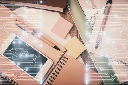 Multi exposure of technology theme drawing over table with phone. Top view. Concept of hightech.の写真素材