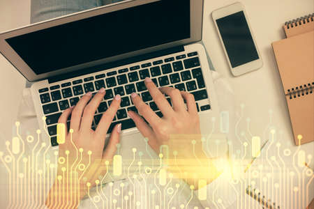 Double exposure of woman hands working on computer and data theme hologram drawing. Top View....