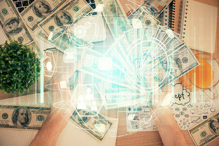 Multi exposure of social network theme drawing hologram and USA dollars bills and man hands.の写真素材