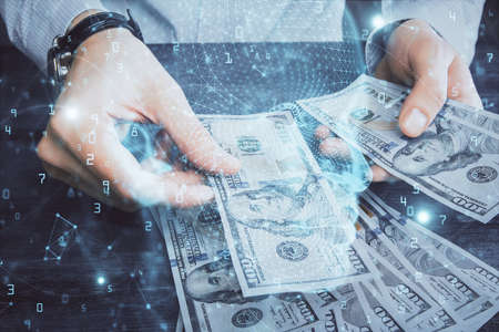 Multi exposure of brain drawing hologram and us dollars bills and man hands. Ai invest conceptの写真素材