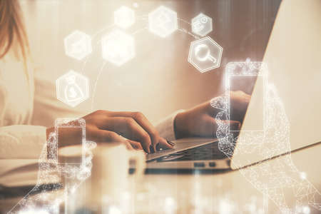 Double exposure of woman hands typing on computer and technology theme drawing. High Tech concept.