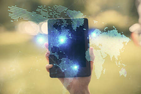 Double exposure of social network sketch hologram and woman holding and using a mobile device.