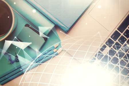 Double exposure of map hologram drawing over study table background with computer. Concept of...