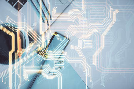 Technology hologram drawing over computer on the desktop background. Top view. Double exposure. Tech concept.の写真素材