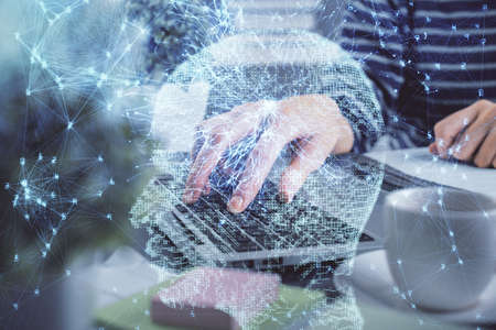 Double exposure of woman hands working on computer and brain hologram drawing. Ai concept.の写真素材