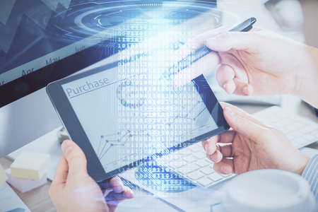 Multi exposure of man's hands holding and using a digital device and data theme drawing. Innovation...