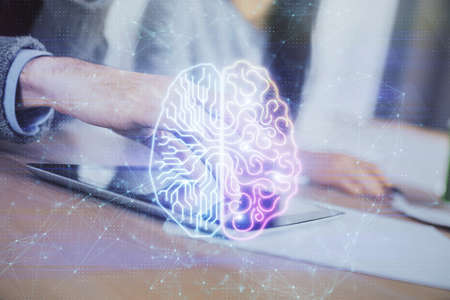 Double exposure of man and woman working together holding and using a mobile device and brain...