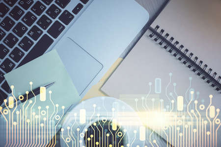 Double exposure of data theme drawing hologram over topview work table background with computer....