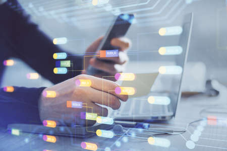 Multi exposure of man's hands holding and using a digital device and data theme drawing. Innovation...