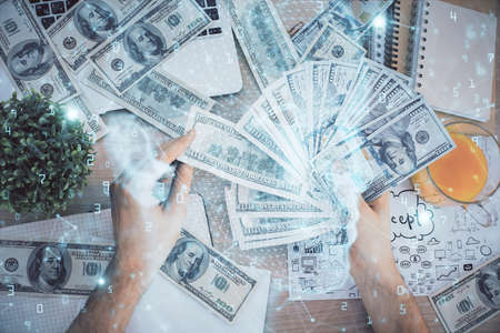 Multi exposure of brain drawing hologram and us dollars bills and man hands. Ai invest conceptの写真素材