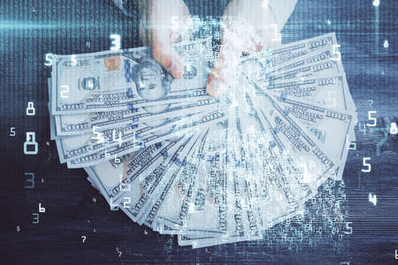 Multi exposure of technology drawing hologram and us dollars bills and man hands. Data conceptの写真素材