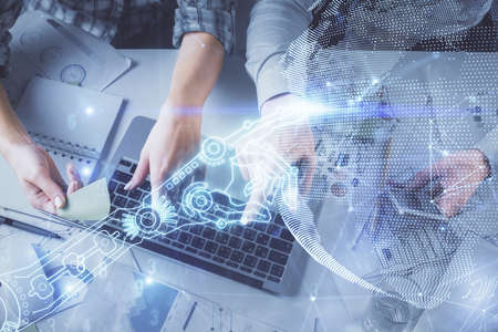 Double exposure of man and woman working together and technology theme drawing. Computer background....