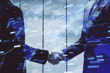 Double exposure of data theme hologram and handshake of two men. Partnership in IT industry concept.の写真素材