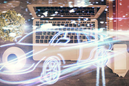 Auto pilot hologram drawing over computer on the desktop background. Top view. Double exposure. Tech concept.の写真素材