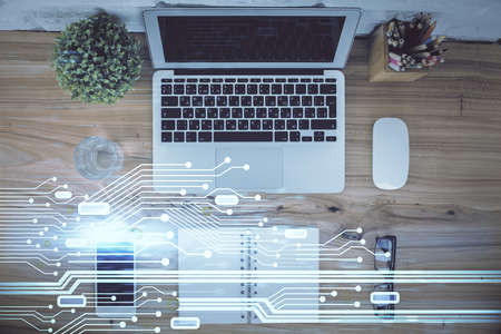 Double exposure of data hologram sketch over study table background with computer. Concept of Ai. Top view.の写真素材