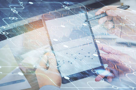 Multi exposure of man's hands holding and using a digital device and data theme drawing. Innovation...