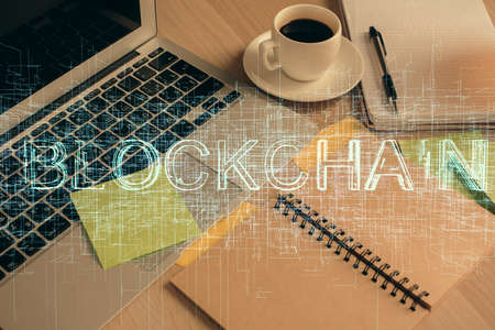 Double exposure of crypto technology drawing and desktop with coffee and items on table background. Concept of blockchainの写真素材