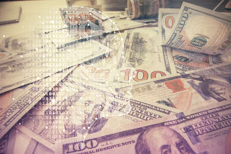 Double exposure of brain drawing over us dollars bill background. Technology concept.の写真素材